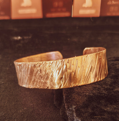 Hand forged copper cuff with textured hammered finish.